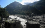 A general view shows damaged houses covered in sludge in the aftermath of the August 26 flash flood, at Betrawati Bazaar in Nepal's Rasuwa district on September 28, 2026. (Photo by Prakash Mathema / AFP)
