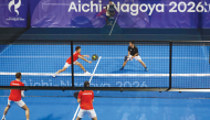 Japan’s Teruaki Ando and Shinnosuke Nakamura (top) play against Lebanon’s Tamim El Hallak and Ralph Tohme during the men’s pairs padel first round match at the Asian Games.