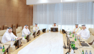 Minister of Commerce and Industry H E Sheikh Faisal bin Thani bin Faisal Al Thani with other officials during the meeting.