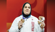 Ouisal Ikhlef celebrates with her bronze medal.
