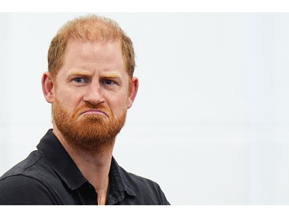 Britain's Prince Harry, Duke of Sussex reacts during a panel discussion during his visit to Ninestiles School, in Birmingham, central England on September 18, 2026, as part of the launch of the INSPIRE education programme ahead of the Invictus Games in Birmingham in 2027. Photo by Aaron Chown / POOL / AFP