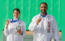 Qatar's Ray Bassil and Mohammed Al-Rumaihi celebrate with their medals on the podium. 