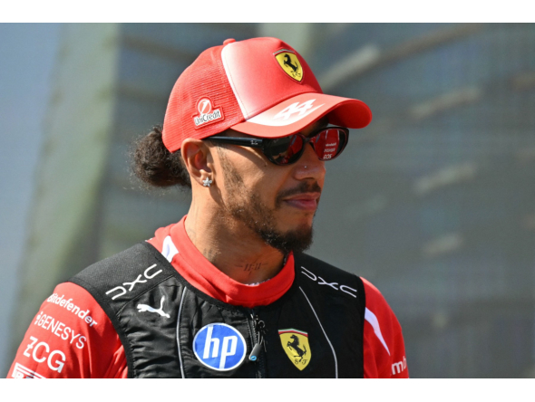 Ferrari's British driver Lewis Hamilton attends the drivers' presentation prior to the Formula One Azerbaijan Grand Prix at the Baku City Circuit in Baku on September 26, 2026. (Photo by Andrej ISAKOVIC / AFP)
