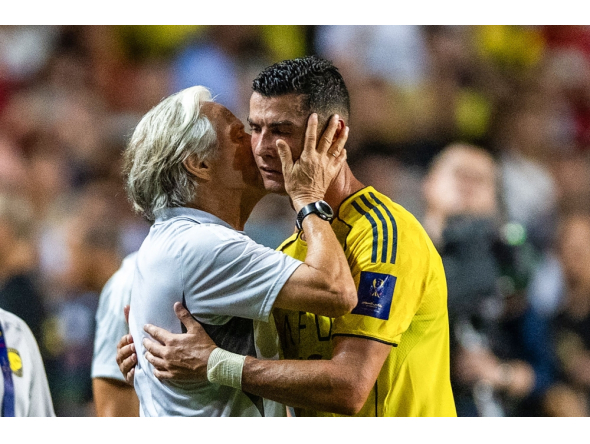 (Files) Al-Nassr's head coach Jorge Jesus (L) embraces Cristiano Ronaldo during the Saudi Super Cup semi-final football match on August 19, 2025. (Photo by Wun Suen / AFP)