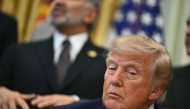 US President Donald Trump listens to US Commerce Secretary Howard Lutnick in the Oval Office of the White House in Washington, DC, on September 30, 2026. (Photo by Kent NISHIMURA / AFP)