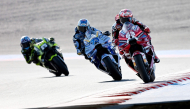 Ducati Lenovo Team rider Francesco Bagnaia of Italy (R) leads BK8 Gresini Racing MotoGP rider Alex Marquez of Spain (C) and SuperFile Trackhouse MotoGP Team rider Raul Fernandez of Spain (L) during the MotoGP class practice session of MotoGP Japanese Grand Prix at the Mobility Resort Motegi in Motegi, Tochigi prefecture on October 2, 2026. (Photo by Toshifumi KITAMURA / AFP)
