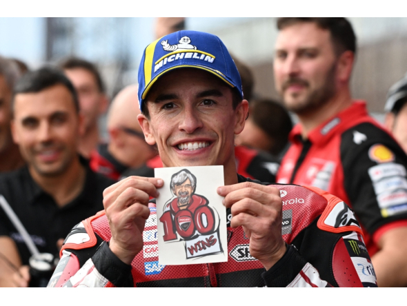 Ducati Lenovo Team rider Marc Marquez of Spain displays his Ducati team's 100th victory sticker at the Parc Ferme during the MotoGP Japanese Grand Prix on October 4, 2026. (Photo by Toshifumi Kitamura / AFP)