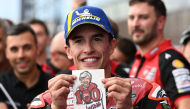 Ducati Lenovo Team rider Marc Marquez of Spain displays his Ducati team's 100th victory sticker at the Parc Ferme during the MotoGP Japanese Grand Prix on October 4, 2026. (Photo by Toshifumi Kitamura / AFP)