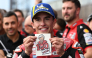 Ducati Lenovo Team rider Marc Marquez of Spain displays his Ducati team's 100th victory sticker at the Parc Ferme during the MotoGP Japanese Grand Prix on October 4, 2026. (Photo by Toshifumi Kitamura / AFP)
