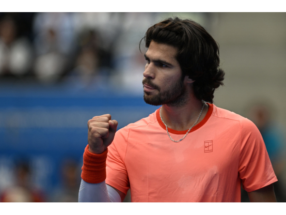 Spain's Carlos Alcaraz reacts as he plays against Canada's Denis Shapovalov during their men's singles quarter-final tennis match at the ATP Tour Japan Open Tennis Championships at the Ariake Tennis Forest Park in Tokyo on October 4, 2026. (Photo by Rie KIKUCHI / AFP)