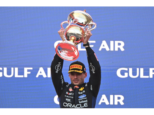 Race winner Red Bull Racing's Dutch driver Max Verstappen lifts his trophy during podium ceremony of the Formula One Bahrain Grand Prix in Sepang on October 4, 2026. (Photo by Jade Gao / AFP)