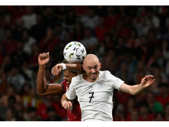 Portugal's defender #13 Renato Veiga and Norway's midfielder #07 Fredrik Aursnes vie for a header during the UEFA Nations League Group 4 football match between Portugal and Norway at Dragao stadium in Porto on October 3, 2026 (Photo by Miguel RIOPA / AFP)