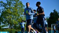 Harry Kane (left) and teammates take part in a team training session yesterday. 