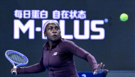 US Coco Gauff hits a return to China's Sun Xinran during their women's singles match at the China Open tennis tournament in Beijing on October 5, 2026. (Photo by Adek Berry / AFP) 