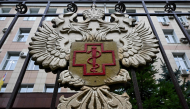 The logo of Russia's consumer and health watchdog Rospotrebnadzor sits on its grounds' fencing in Moscow on October 5, 2026. (Photo by Igor Ivanko / AFP)