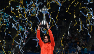 Spain's Carlos Alcaraz holds the trophy as he celebrates beating Czech Republic's Jiri Lehecka in the men's singles final during the Japan Open tennis tournament at the Ariake Tennis Forest Park in Tokyo on October 6, 2026. (Photo by Rie KIKUCHI / AFP)