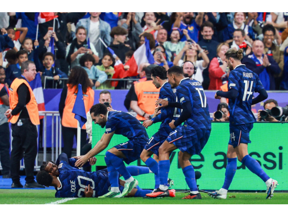 France’s Michael Olise (left) celebrates scoring his team’s fourth goal with teammates. 