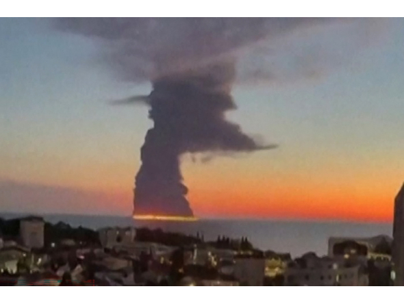 This screen grab taken from an UGC obtained by AFPTV on October 6, 2026, shows a fire on a vessel believed to be an oil tanker at the Russian city of Sochi on the Black Sea, amid the Russian invasion of Ukraine. (Photo by -UGC / UGC / AFP)