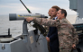 This handout photograph released and taken by the French Ministry of the Armed Forces and Veterans on October 6, 2026 shows French President Emmanuel Macron (L) attending the first test launch of a new intercontinental missile, fired from a nuclear-powered ballistic missile submarine off the coast of Finistere, western France, on October 6, 2026. (Photo by Benjamin PAPIN / French Ministry of the Armed Forces and Veterans / AFP) 