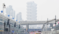 Air pollution is seen across the skyline as people prepare the street circuit before the Formula One Singapore Grand Prix night race.