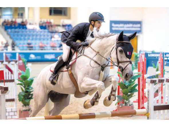 Mohammed Yousef Al Jaber guides Shotgun 7 over a fence.