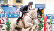 Mohammed Yousef Al Jaber guides Shotgun 7 over a fence.