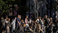 People cross a street in Ginza area of Tokyo on October 8, 2026. (Photo by Yuichi YAMAZAKI / AFP)
