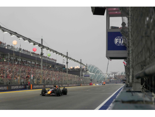 Red Bull Racing's Dutch driver Max Verstappen wins the sprint race ahead of the Formula One Singapore Grand Prix at the Marina Bay Street Circuit in Singapore on October 10, 2026. (Photo by Ng Han Guan / Pool / AFP)