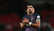 Tottenham Hotspur's English striker #19 Dominic Solanke applauds fans, on October 10, 2026. The game finished 1-1. (Photo by Paul Ellis / AFP) 