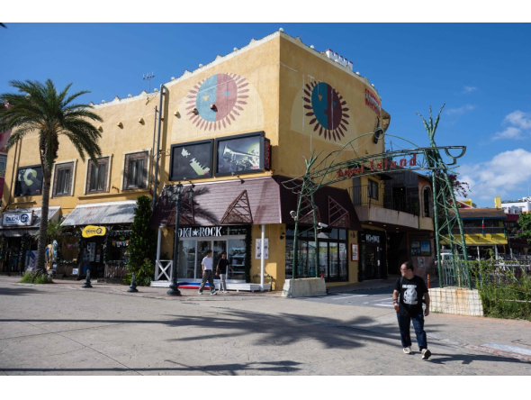 A man walks past an American themed mall at the Mihama American Village in Okinawa prefecture on October 10, 2026. (Photo by Andrew Caballero-Reynolds / AFP)