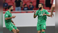 Al Ahli’s Naim Sliti (right) celebrates after scoring a goal. 
