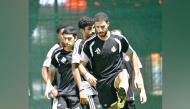 Al Gharafa players in action during a training session.