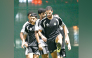 Al Gharafa players in action during a training session.