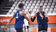 Qatar’s Cherif Younousse and Ahmed Tijan celebrate a point.