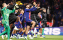 PSG’s Khvicha Kvaratskhelia (centre) celebrates team’s victory over Le Mans FC with teammates on Saturday. (AFP)