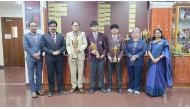 Principal of BPS, Dr. Anand R Nair, with teachers and the students who won the competition.