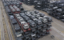Chinese-made cars are seen in specialised vehicle racks in preparation for loading onto ships for export at the Taicang Port area of Suzhou Port on October 12, 2026. (Photo by CN-STR / AFP) 