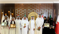 Officials with the winners of the literary competition.