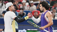 Belgium’s Zizou Bergs (left) shakes hands with Spain’s Carlos Alcaraz at the end of their match.