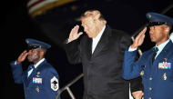 US President Donald Trump disembarks Air Force One upon arrival to Harry Reid International Airport in Las Vegas, Nevada, in the early hours of October 14, 2026. (Photo by Kent Nishimura / AFP)