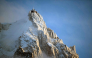 (Files) This photograph shows L'aiguille du Midi of the Massif du Mont-Blanc mountain range in the French Alps in France, on February 11, 2026. (Photo by Olivier Chassignole / AFP)