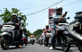 Motorcyclists queue to refuel at a gas station in Denpasar amid a fuel supply shortage on Indonesia's resort island of Bali on Oct 14, 2026. (Photo: AFP/Sonny Tumbelaka)