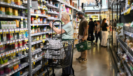 People shop for groceries at a supermarket in Manhattan on August 25, 2026 in New York City. US consumer inflation climbed more than anticipated in September, government data showed October 14, 2026, as the US war with Iran pushed energy costs higher, deepening strains on American households ahead of next month's midterm elections. The consumer price index (CPI) was slightly hotter than analysts expected, rising to 3.7 percent on a year-on-year basis, said the Department of Labor. This was an acceleration from 3.4 percent in August. (Photo by ANGELA WEISS / AFP)
