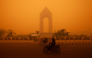 Motorcyclists ride in the morning in Palangkaraya, Central Kalimantan on October 14, 2026, amid thick haze from forest and land fires in the region. (Photo by Reina / AFP)
