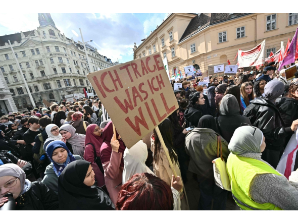 (Files) A protester holds a placard reading 