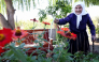 The 117-year-old Qamile Marra poses during an interview with AFP in the garden of her home in the village of Ferras, on October 3, 2026.(Photo by Adnan Beci / AFP)
 