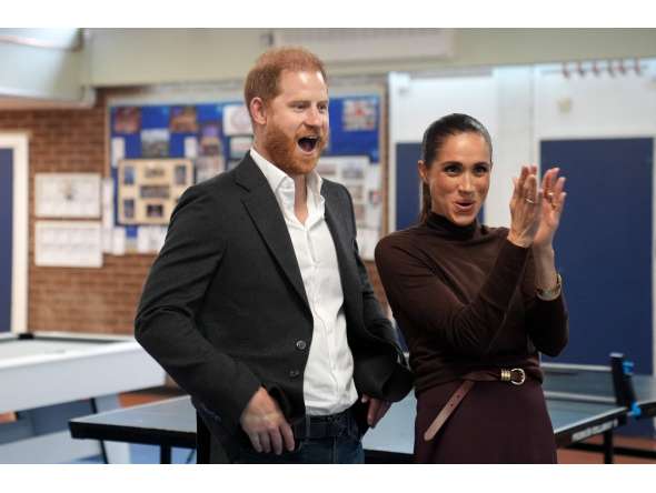 Britain's Prince Harry, Duke of Sussex and his wife Meghan, Duchess of Sussex, react during a visit to Epic Partners in Nottingham, central England on October 15, 2026. Photo by Joe Giddens / POOL / AFP