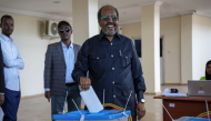 (FILE PHOTO) Somalia's President Hassan Sheikh Mohamud casts his ballot during local council elections in Mogadishu on December 25, 2025. (Photo by Hassan Ali ELMI / AFP)