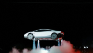 A grab taken on October 16, 2026 from a live feed released by Tesla shows the company unveiling on October 15 its next-generation Roadster electric car in McGregor, Texas, United States. (Photo by Tesla / AFP)