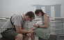 Tourists wear protective masks while seated across Marina Bay Sands in Singapore on October 15, 2026, as the country continues to be shrouded in haze caused by fires in Indonesia / AFP